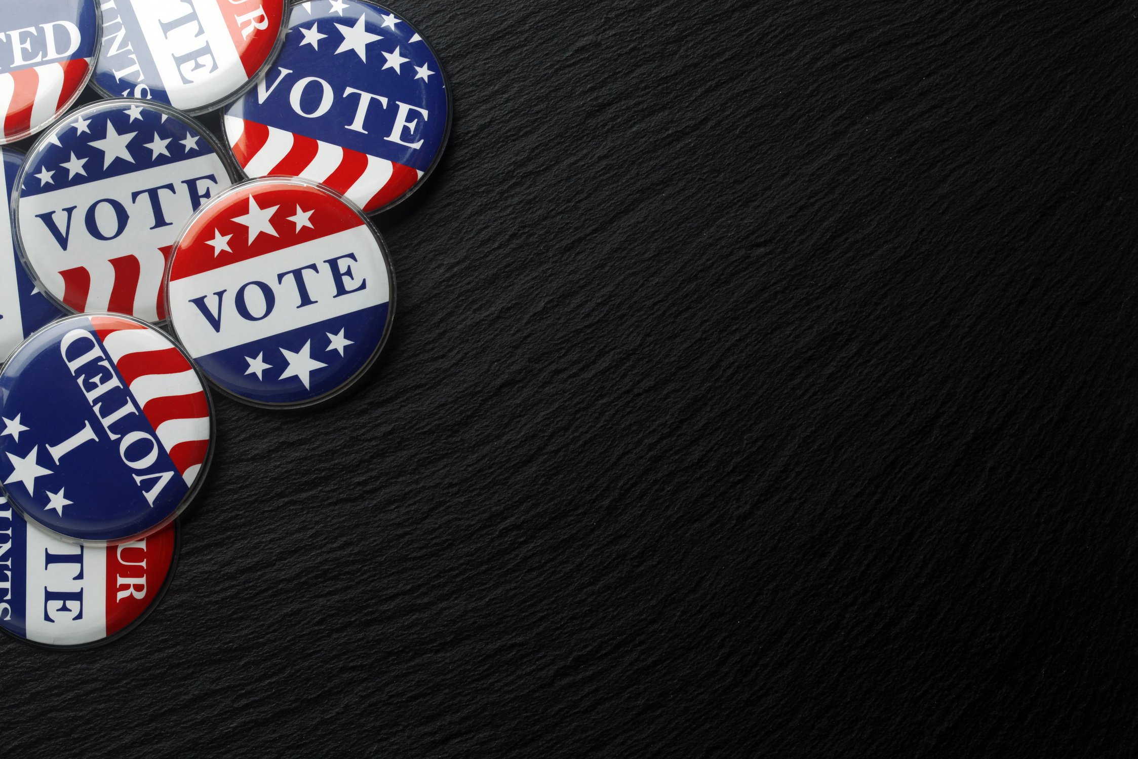 Red, white, and blue vote buttons background